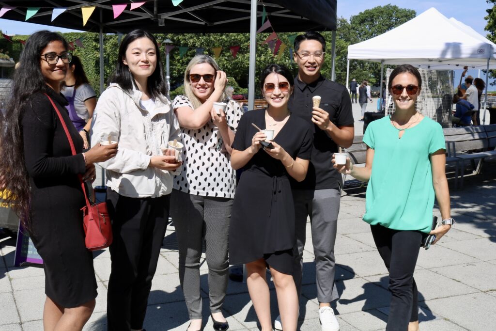 A group of people smiling at an event